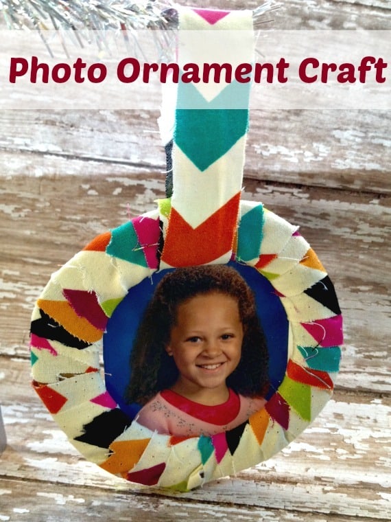 Make this photo ornament to remember the fun ages of your kids or to show off your family picture! Made with fabric, cardboard, and more!