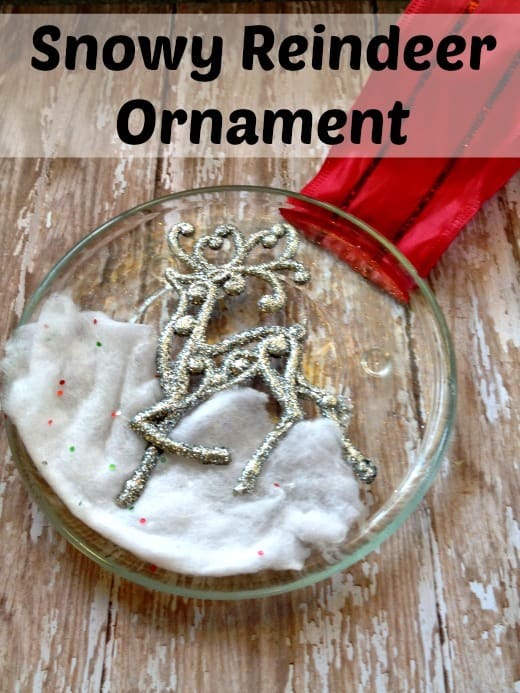 This custom christmas ornament is super easy and super cute! Made with all dollar store items. Made with Glass candle base, snow fabric, ribbon, and glue!