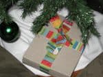 box with ribbon under a christmas tree