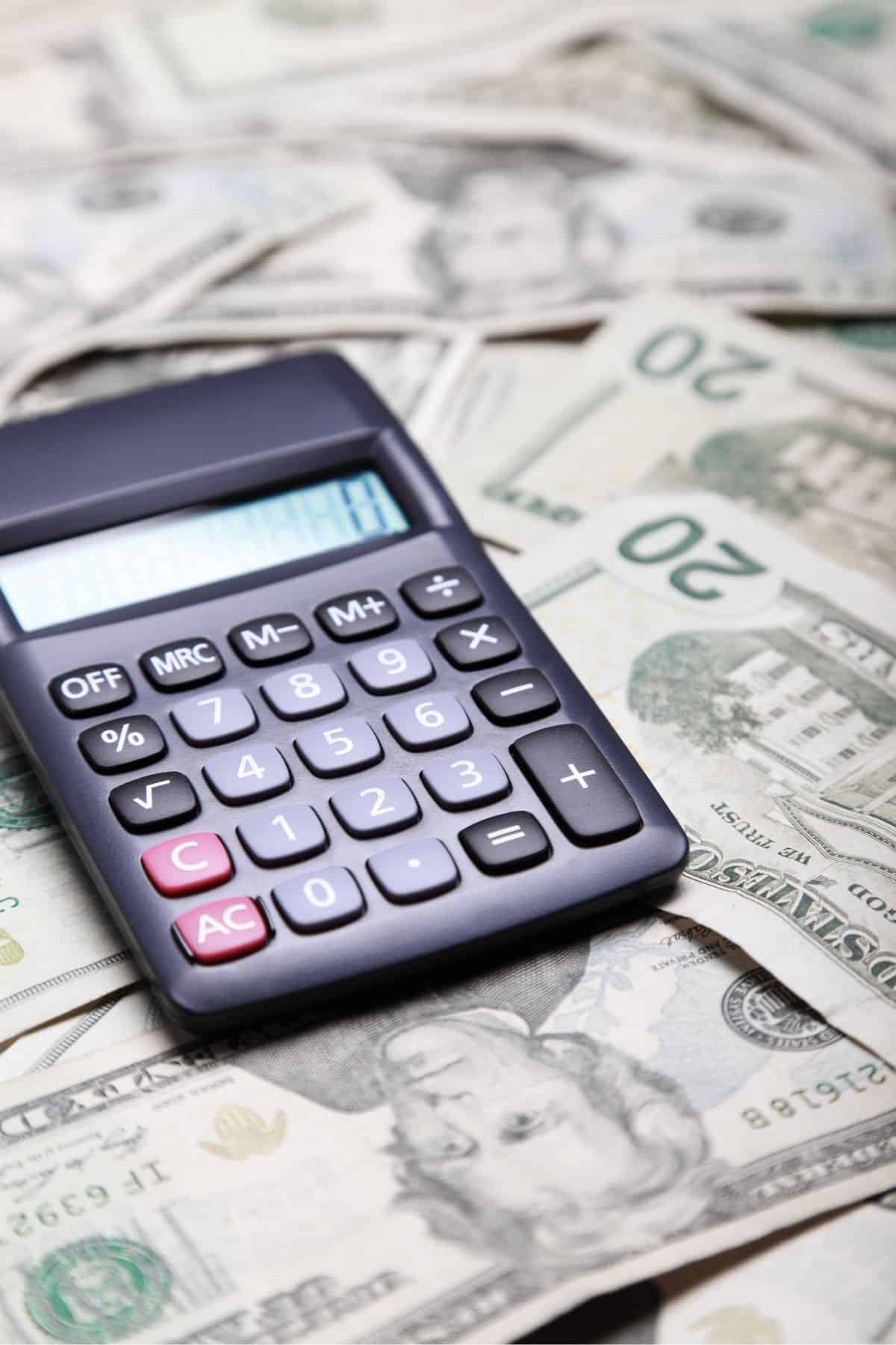 Calculator o top of $20 bills