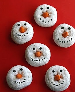 These cute snowman donuts are an easy christmas breakfast. Made with powdered donuts, icing, and candy corn.