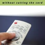 TV controller with TV in the background with text overlay that says "how to get a lower cable bill without cutting the cord"