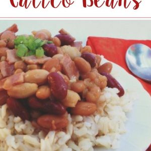 white plate with rice and slow cooker calico beans on top