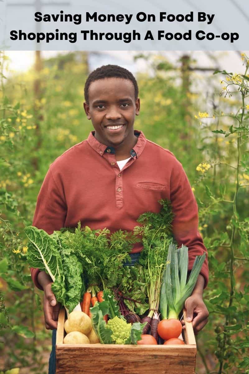 Boy holding a box of produce.