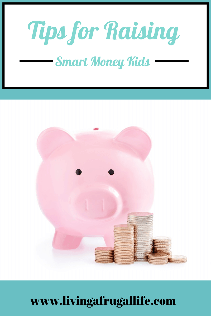 Pink piggy bank  with stacks of quarters, pennies, and dimes next to it.  There is a text overlay that says tips for raising smart money kids.