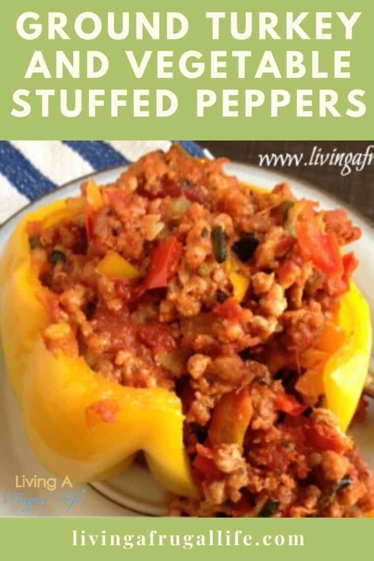 Ground turkey and vegetables with a tomato sauce in a yellow bell pepper with no top. Has a text overlay that says ground turkey and vegetable stuffed peppers.