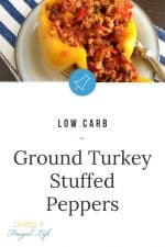 Ground turkey and vegetables with a tomato sauce in a yellow bell pepper with no top. Has a text overlay that says ground turkey stuffed peppers.