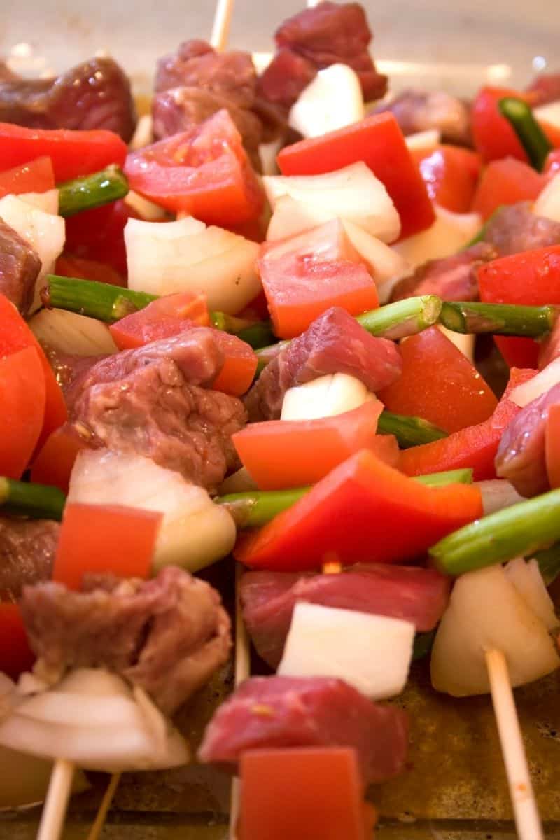Prepared shish kabobs with peppers on skewers
