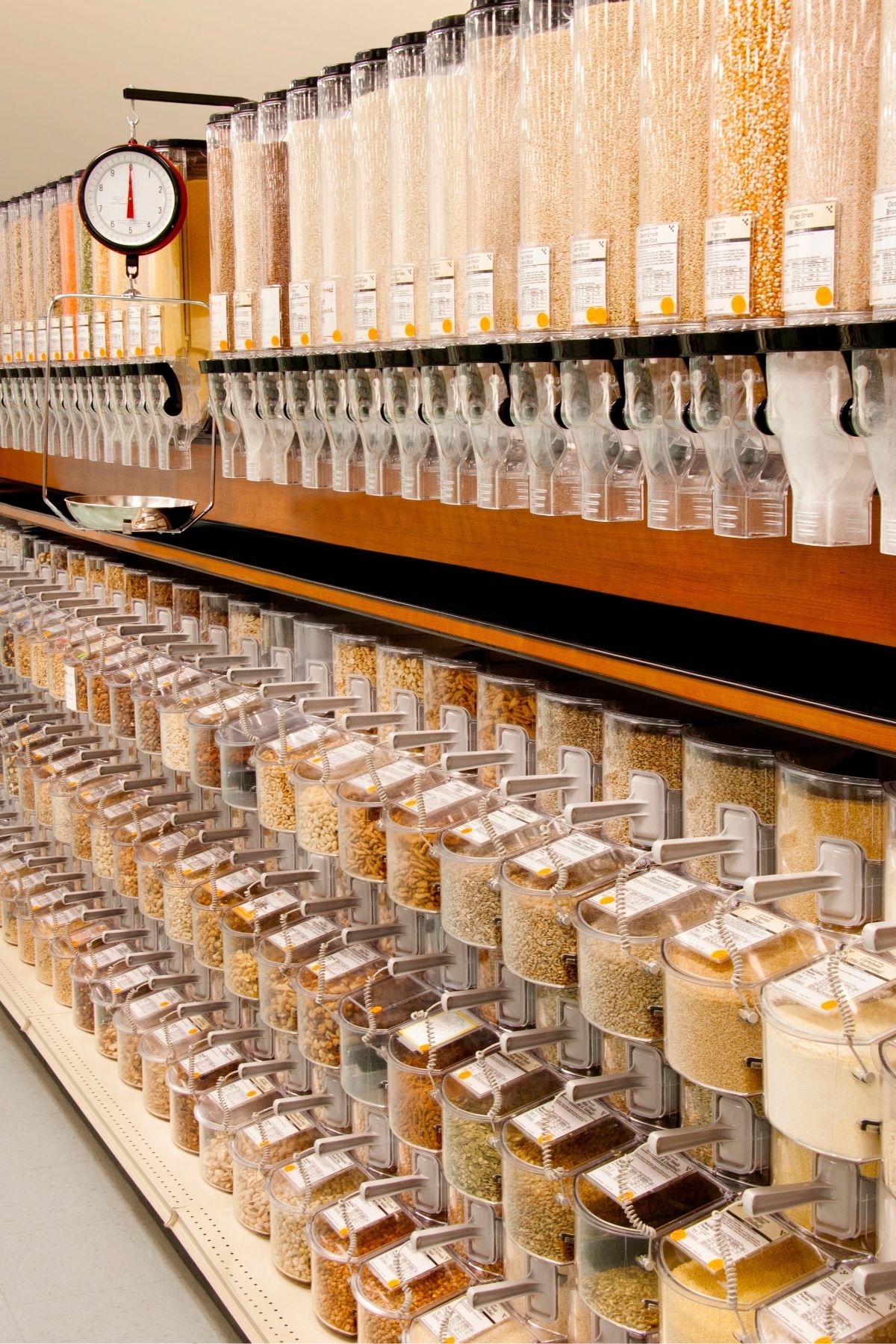 Aisle full of bulk food bins at a grocery store.