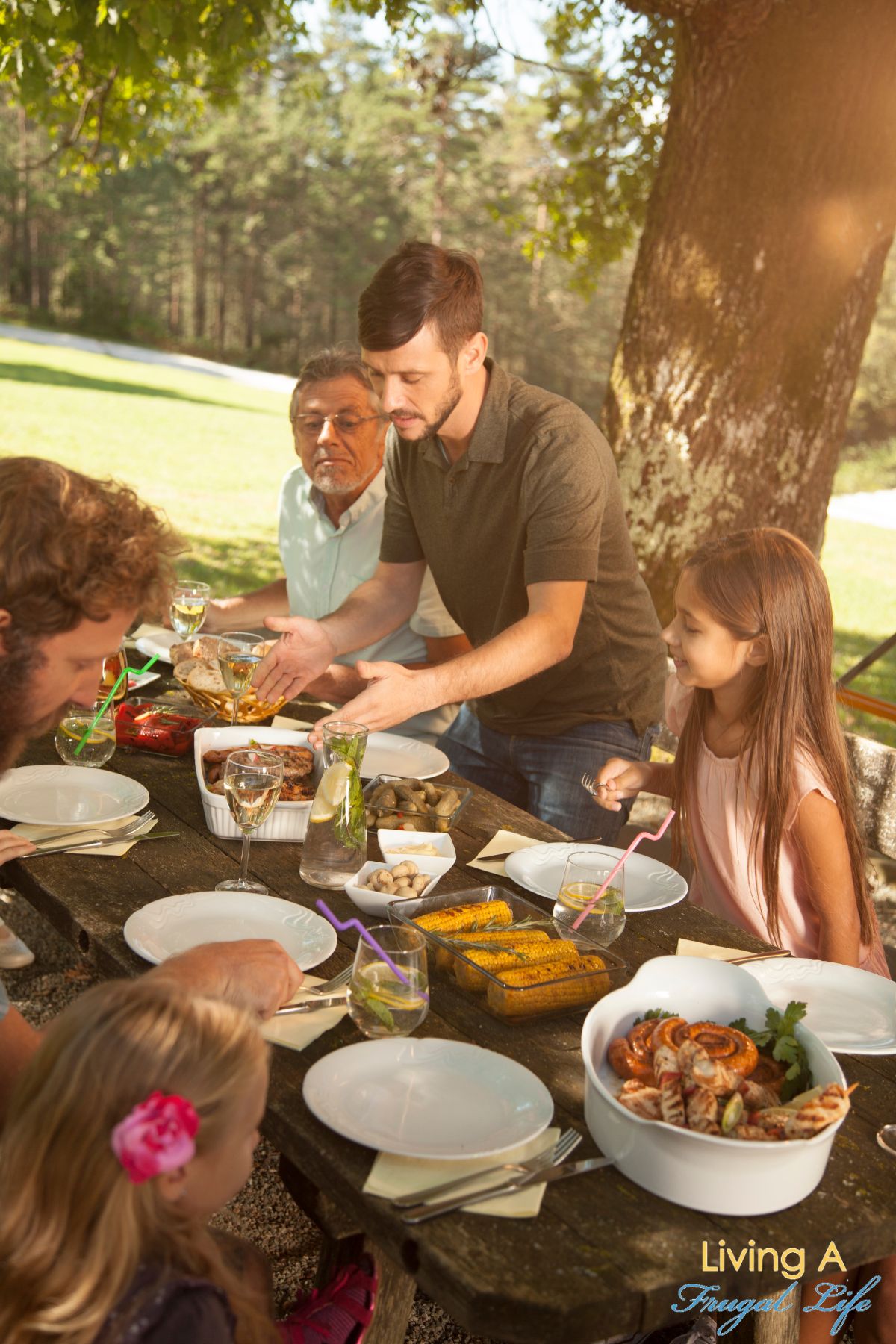 A family having dinner during a staycation in the park